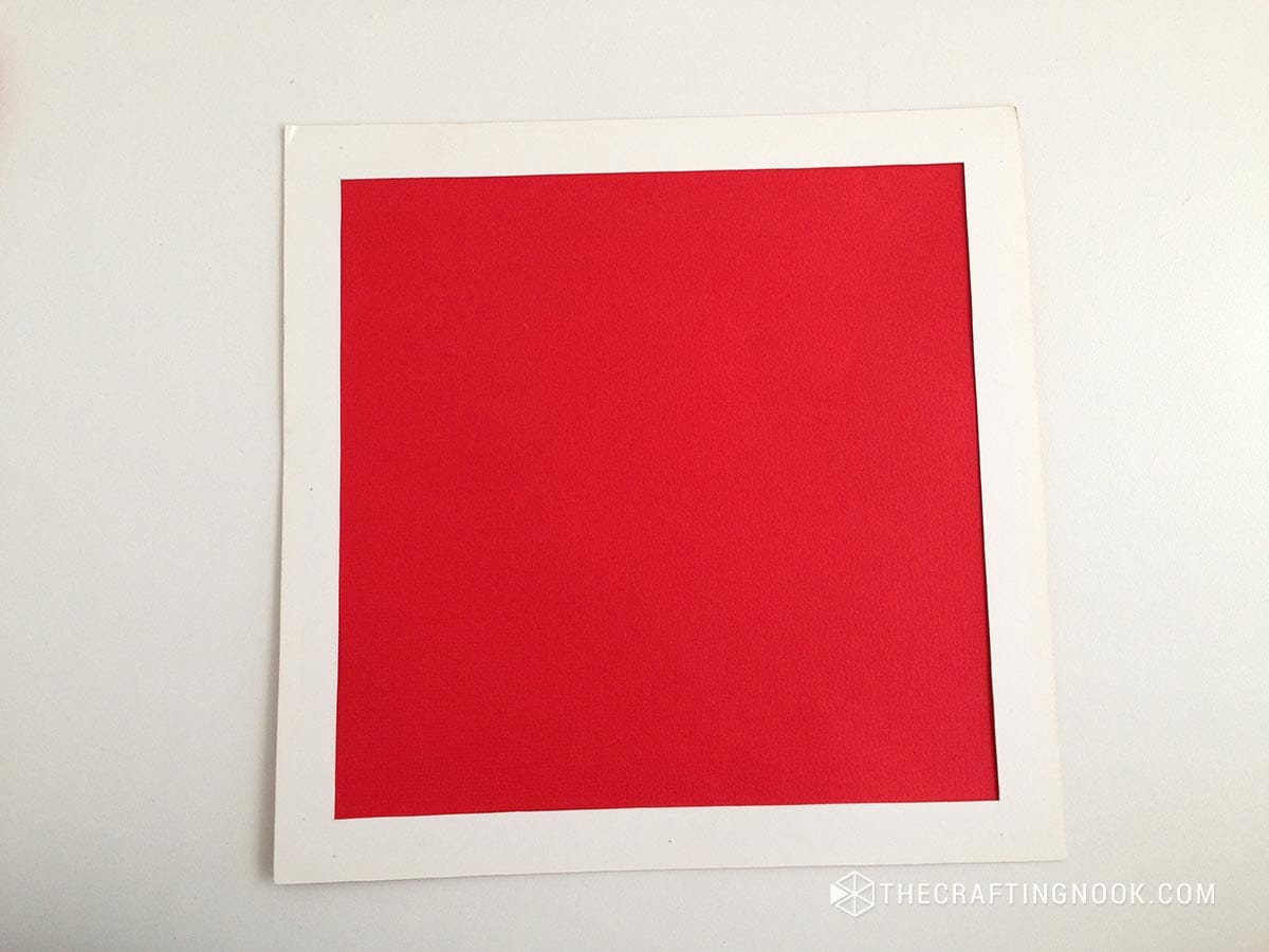 white cardstock frame around the red cardstock