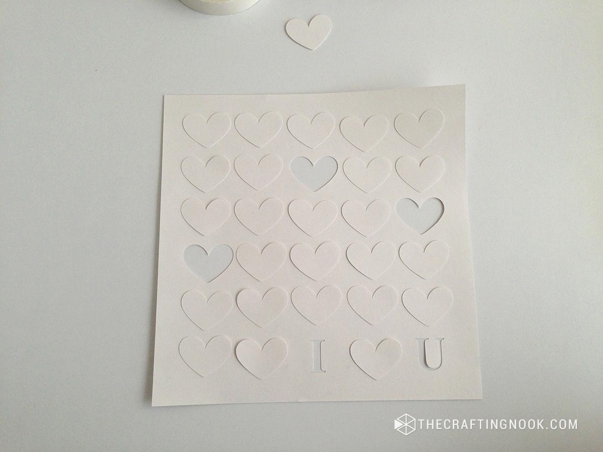  white cut cardstock recreating
 the design with hearts