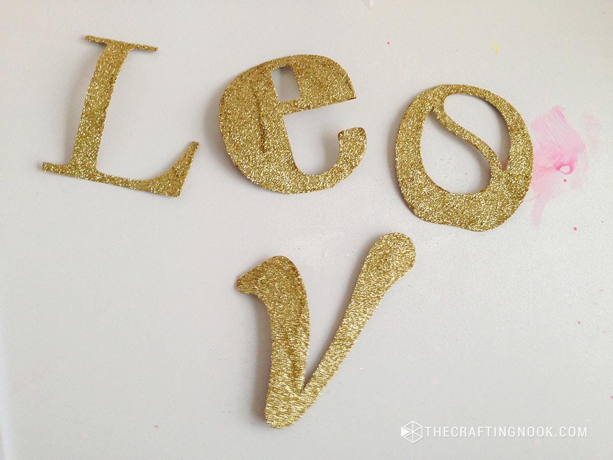 view of the result after removing excess glitter from the letters