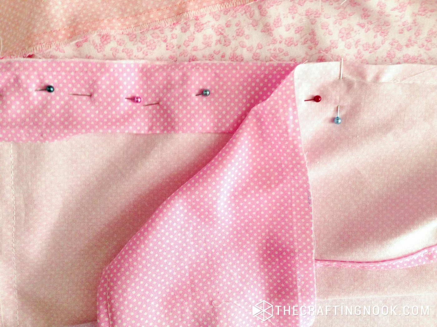 showing the 4 layers pinned together to sew along the edge
