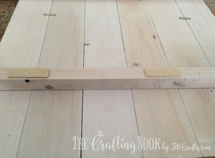 adding adhesive felt protection to the back of the wood plank headboard