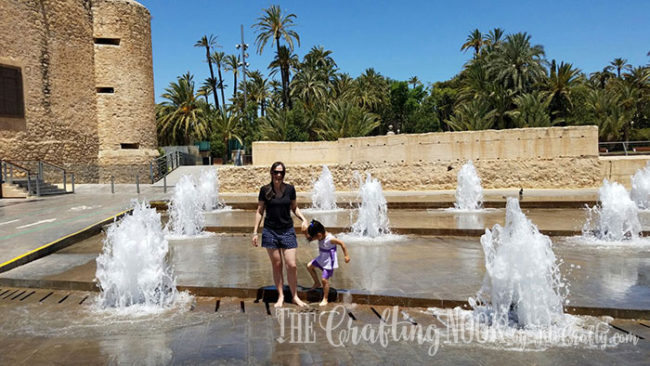 me and my daughter playing in a fountain in Elche-spain