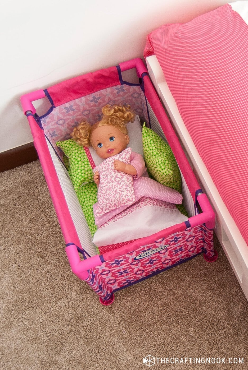 Overhead view of the crib with the DIY Bedding Set inside with a baby doll