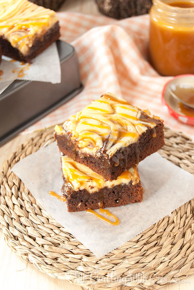 finished caramel cheesecake brownies on parchment paper