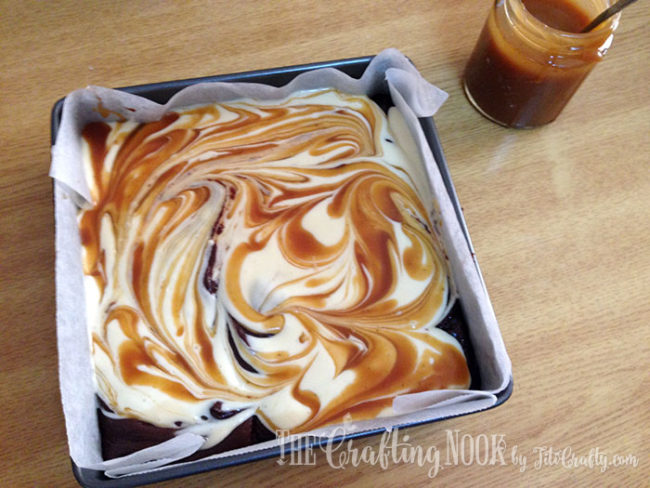 using toothpick to make swirls in caramel and cheesecake batter