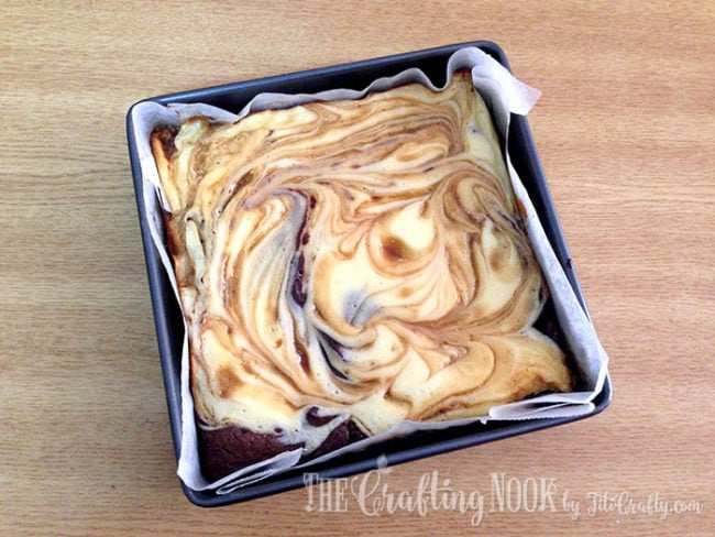 salted caramel cheesecake brownies baked and out of the oven