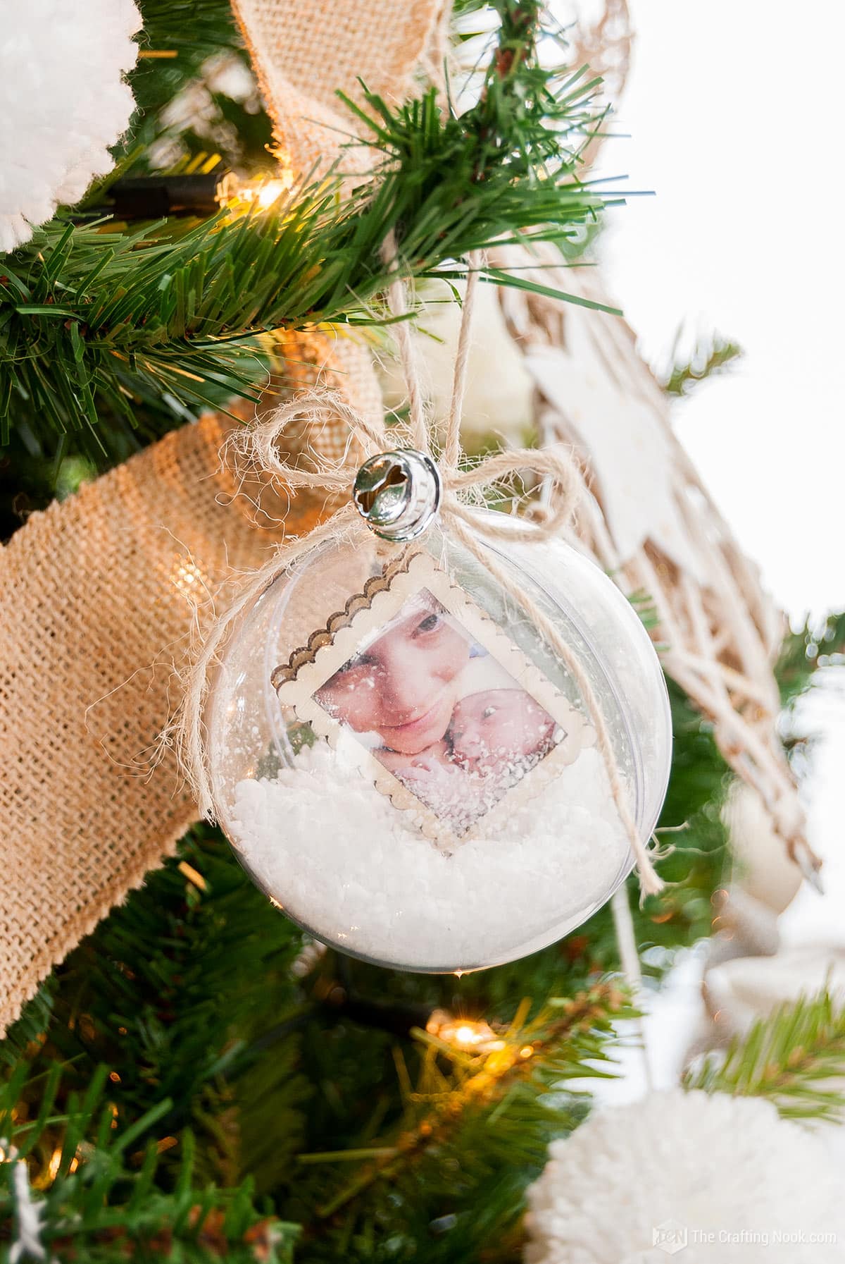 closeup view of Snow Globe Christmas Ornaments on the tree