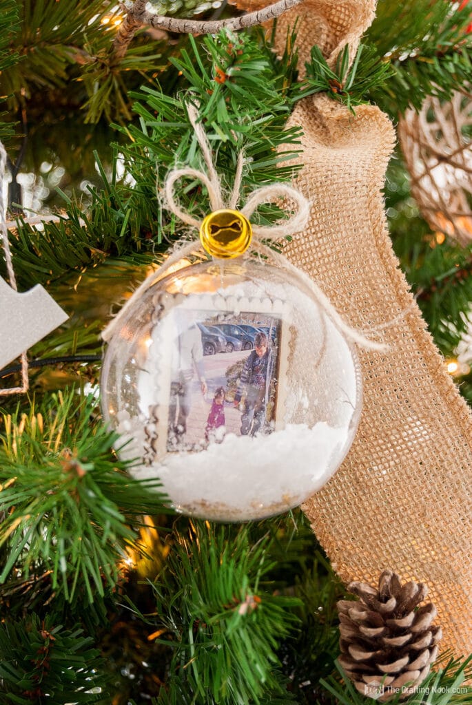 closer view of Snow Globe Christmas Ornaments on the tree