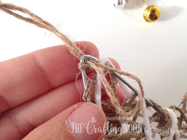 view of the process of inserting the knot in the twine star