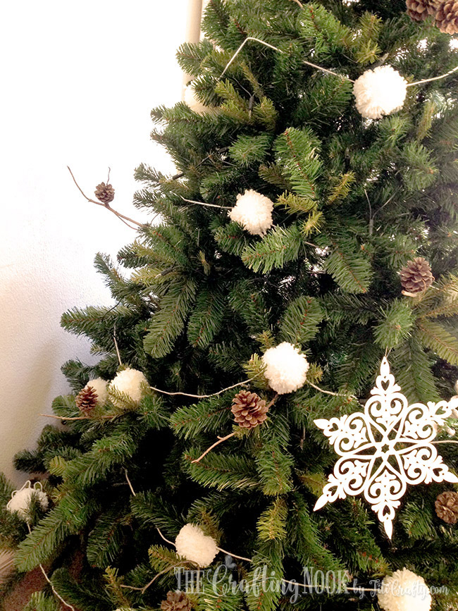view of  pompom garland on the christmas tree