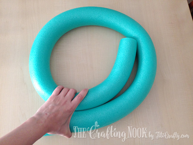 Bending the pool noodle into an spiral 