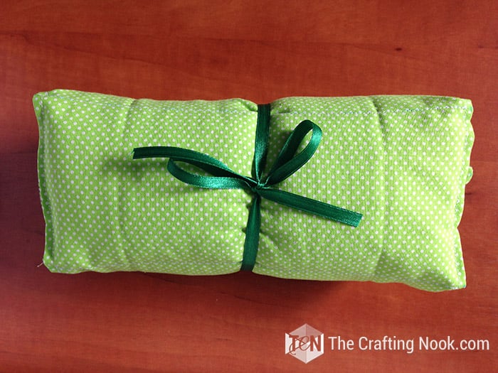 view of the diy Heating Pad rolled up and closed with a ribbon