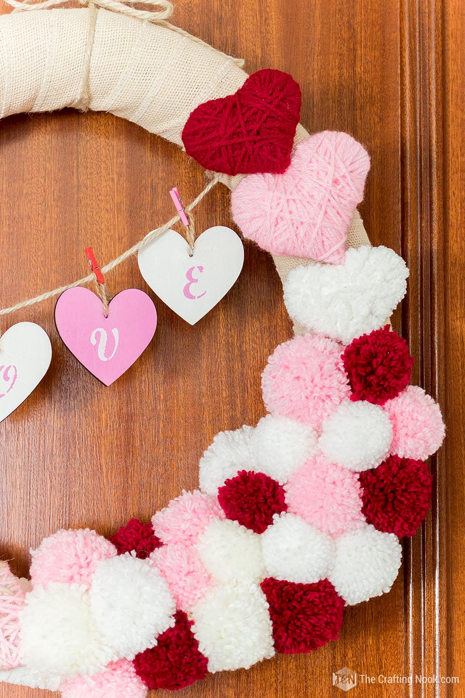 closeup of the yarn hearts and pompoms