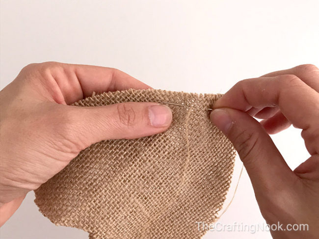 sewing two pieces of burlap together