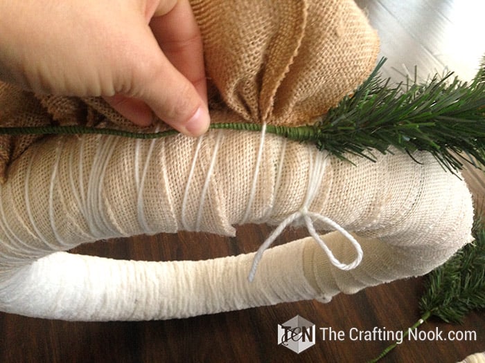 inserting pine tree springs between the threads
