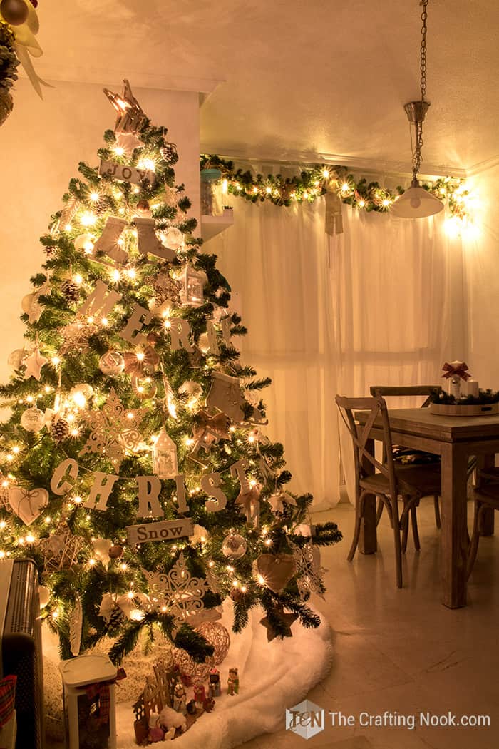 general view of living room at night with the Christmas tree lights on