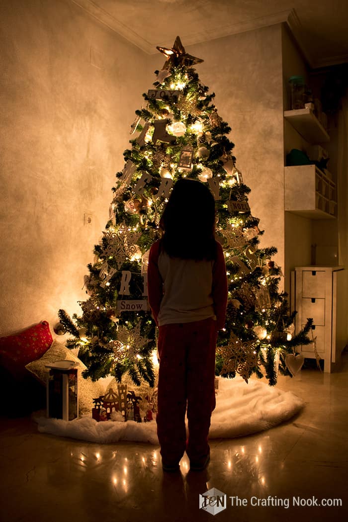 general view of my daughter looking at the illuminated Christmas Tree