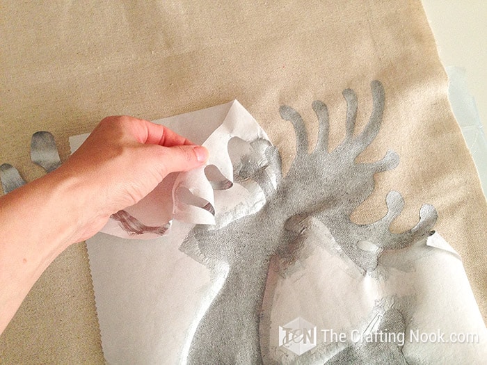 removing the freezer paper from the rustic fabric