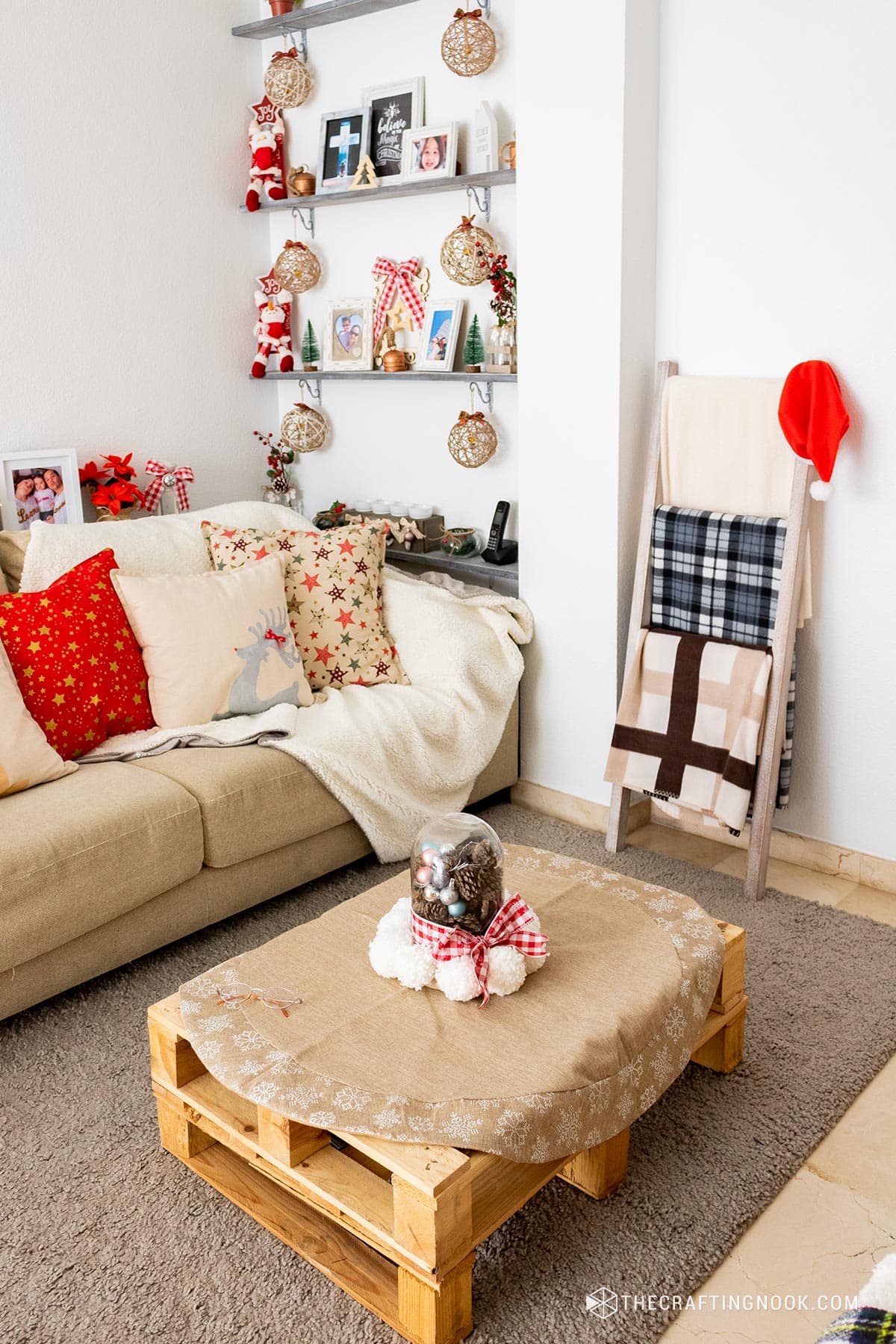 general angled view of  coffee table, sofa, shelf and wooden stairs