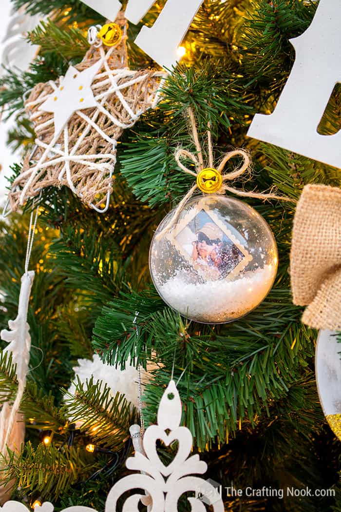 closer view of memory keepsake ornament on White Rustic Christmas Tree 