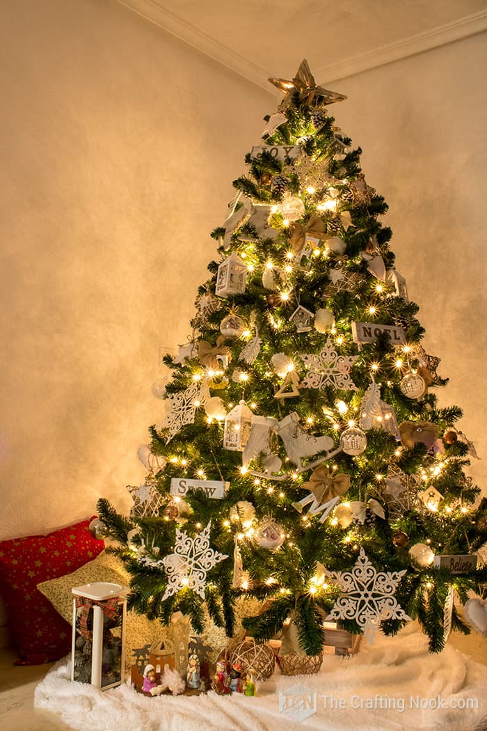 rustic christmas tree whit lights on in night