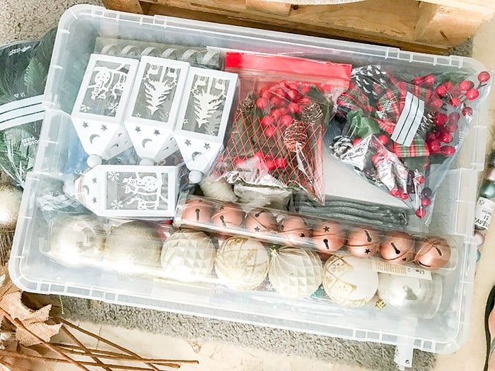 fill the  large plastic box with ornaments 