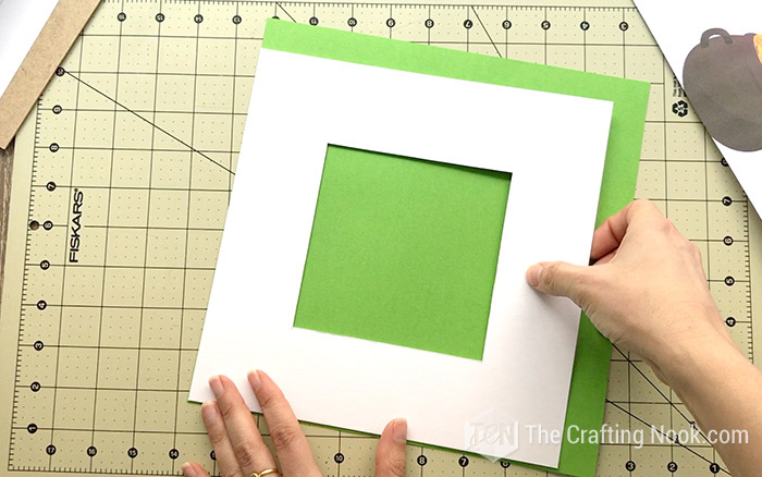 Use the original passe-partout to Create a new passe-partout with green cardstock