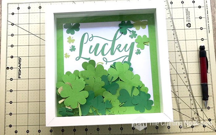 The St. Patrick's Day Shadow Box ready with the backing and all the clovers