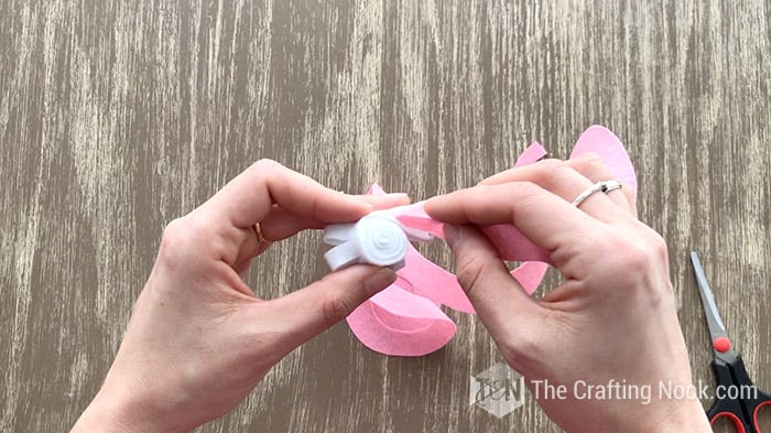 placing the end of the felt spiral withing the filled white felt