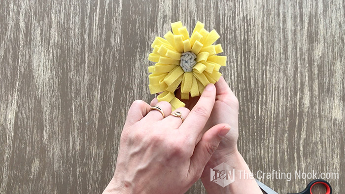 Showing the look of the yellow felt flower