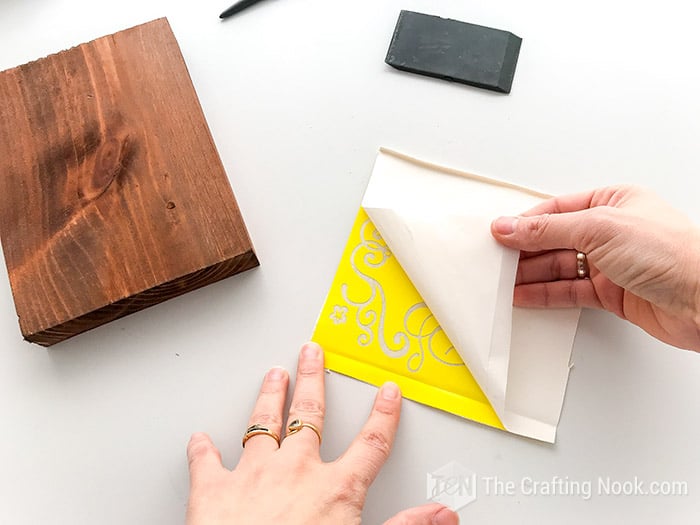 Removing the backing from the vinyl 