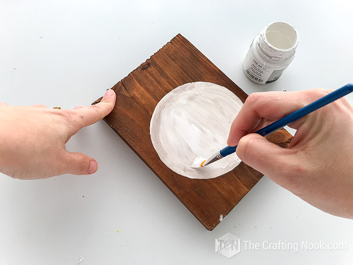 The whole circle painted in white chalk paint for the body of the wooden easter signs Bunny Butt