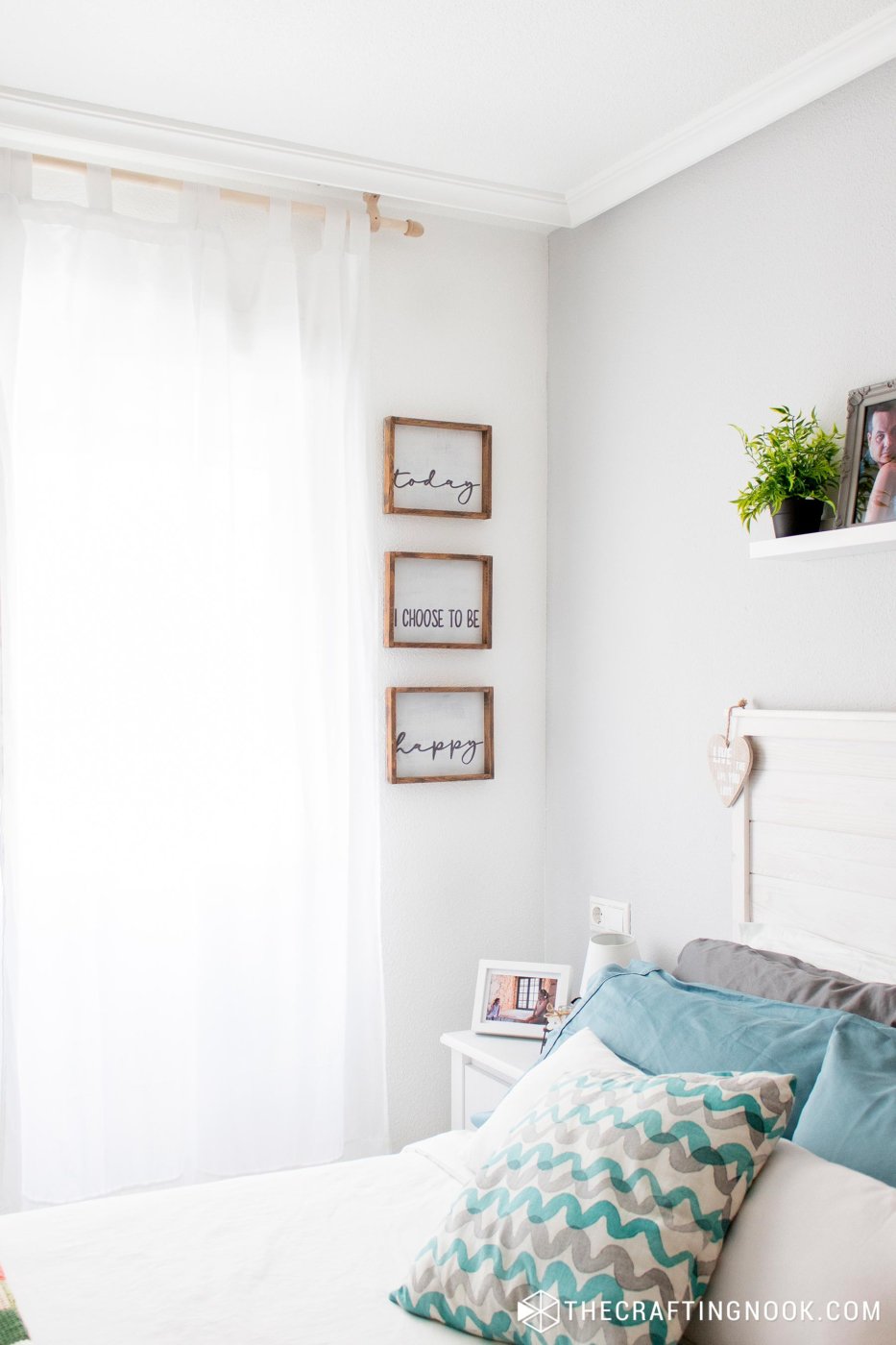 View from the bed of the corner where the Farmhouse DIY Wood Signs are placed 