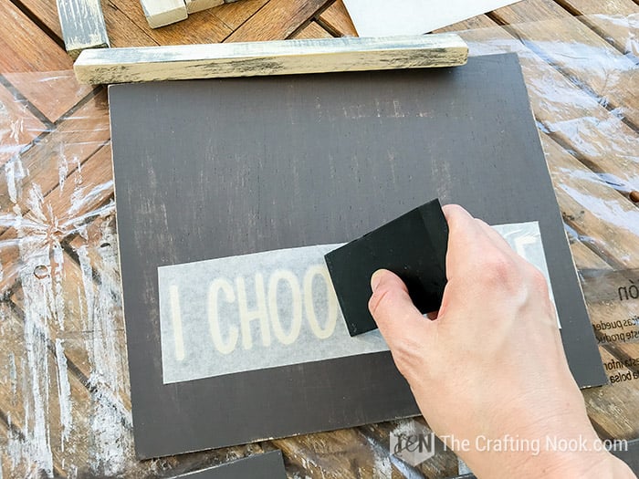 Applying the stencil to one of the Farmhouse Wood Signs