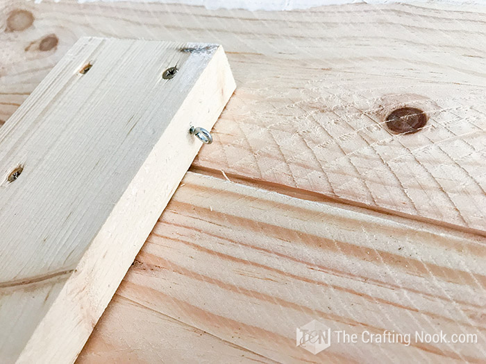 closeup of closed hook in the inner side of the headboard