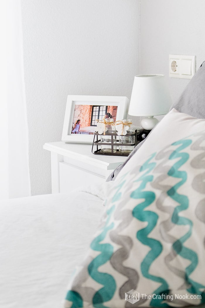 distant view of bedside table with pictures