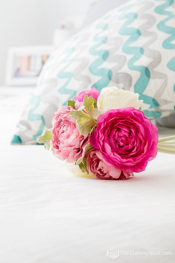 close view artificial flowers on the bed