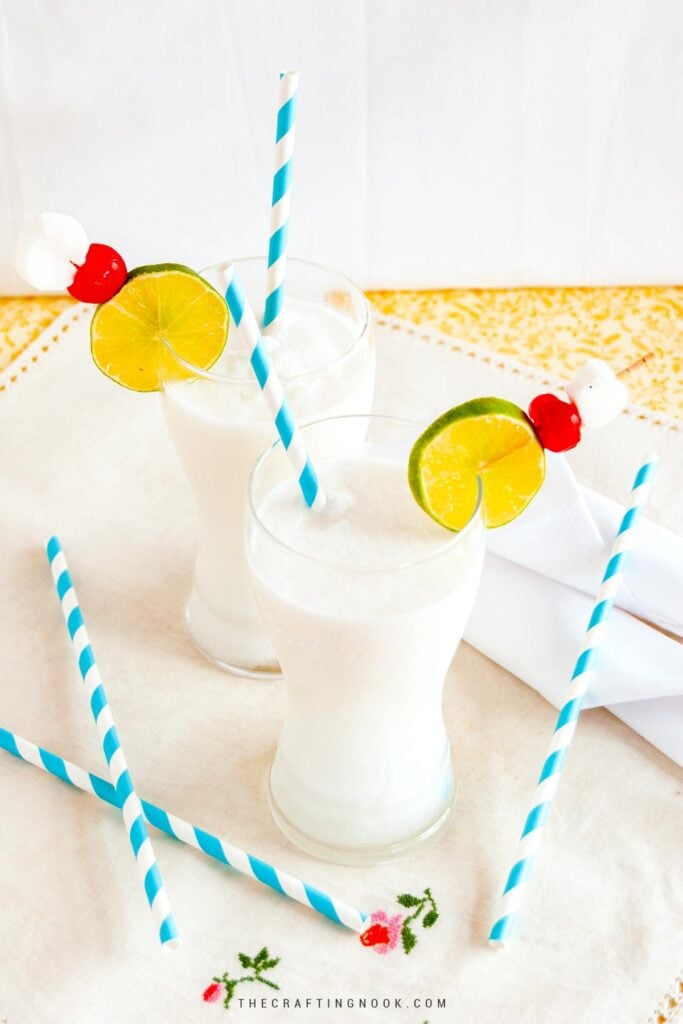 Slight upper view of two cups with Frozen coconut limeade Drink with Malibu Recipe