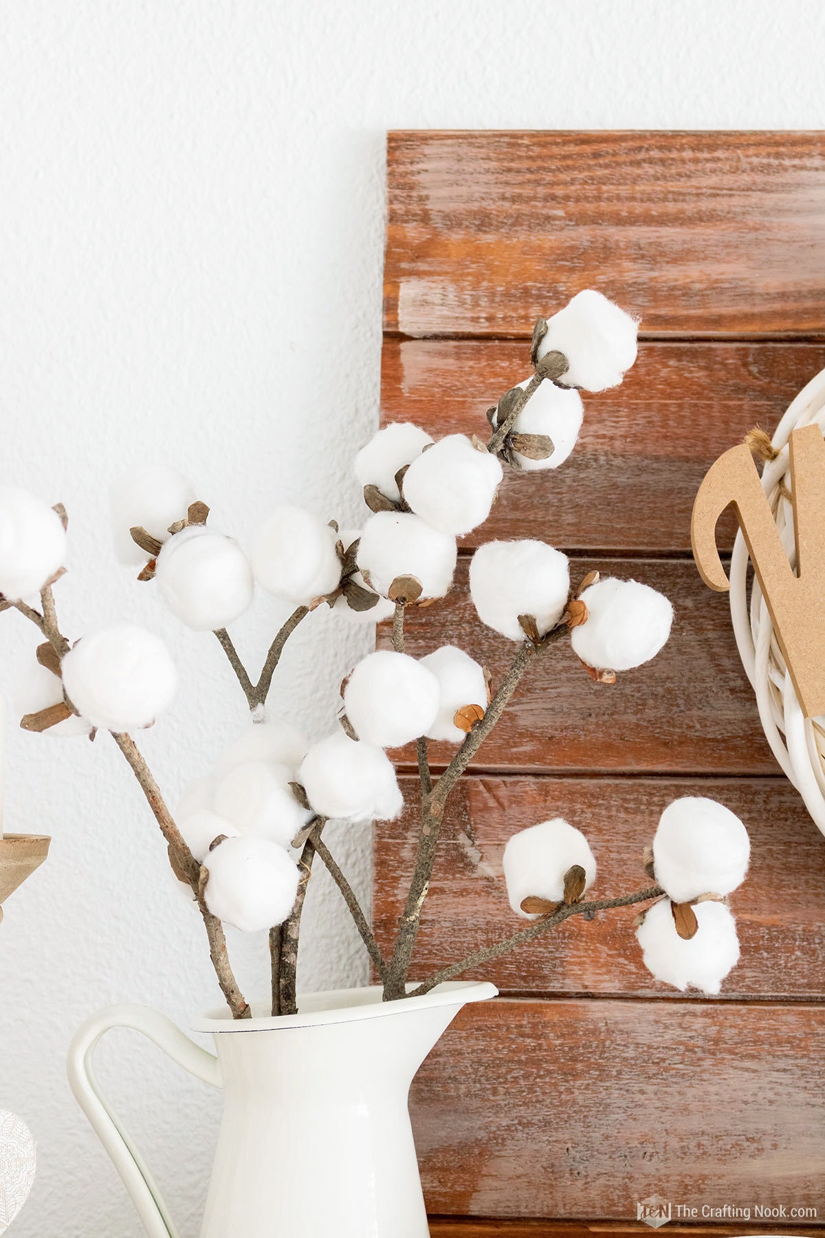 close up of the Faux DIY Cotton Stems (In a few Simple Steps) placed in a pitcher