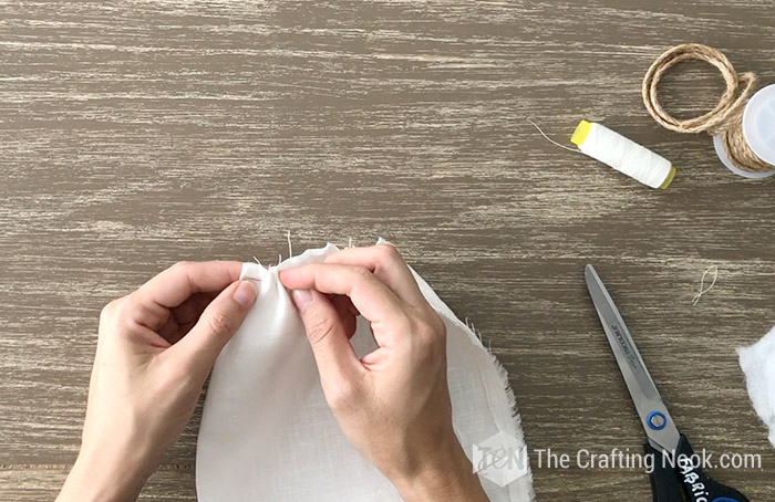 Pull ends of thread to ruffle fabric.