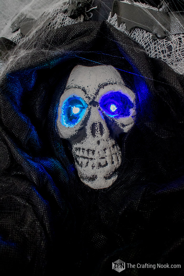 closeup of Easy Halloween Skeleton Wreath light eyes