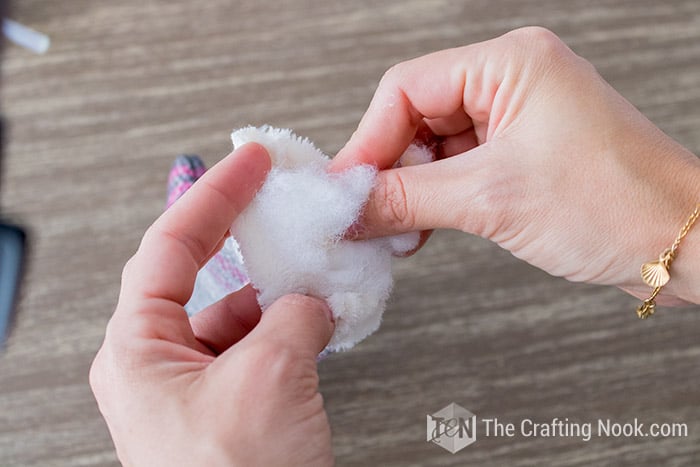 stuffing the entire mitten with cotton
