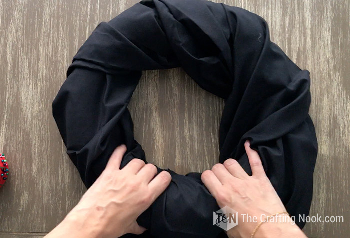 Craft foam wreath wrapped in black fabric