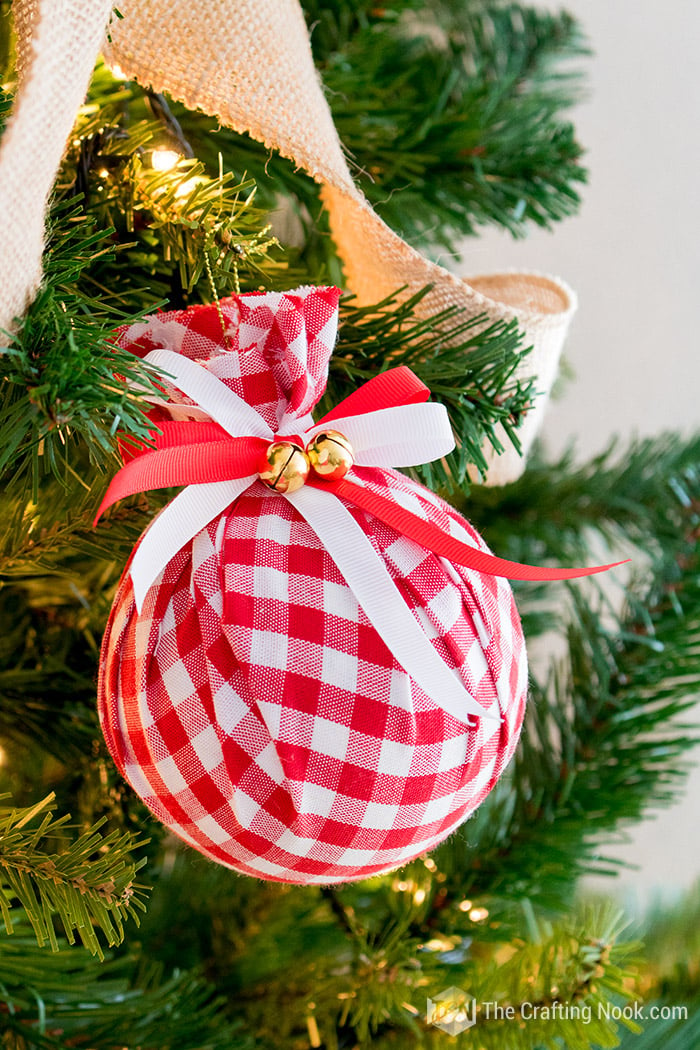 closer angled view of DIY Buffalo Check Christmas Ornament on christmas tree