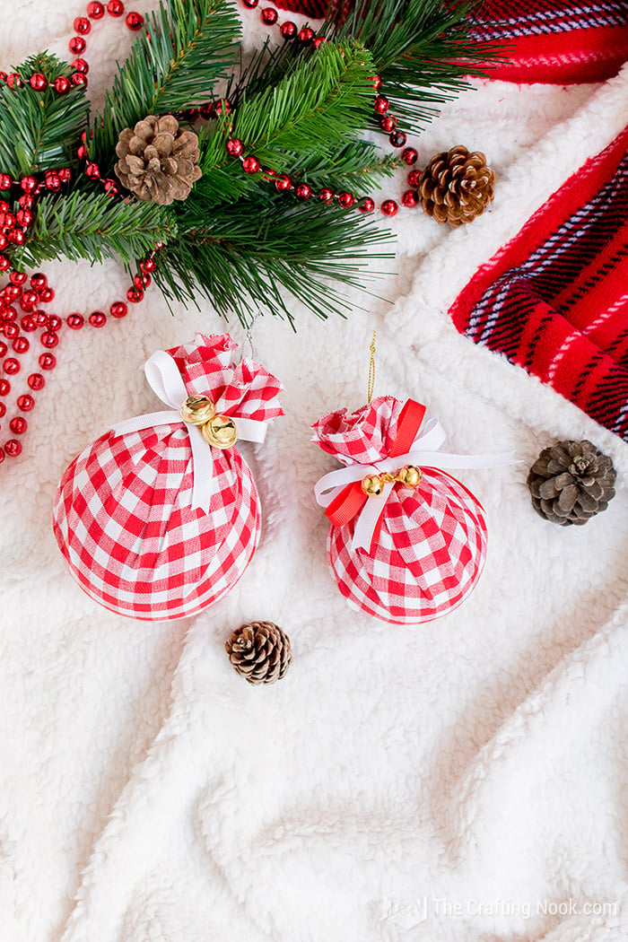 DIY Buffalo Check Christmas Ornaments, pinecones on white blanket
