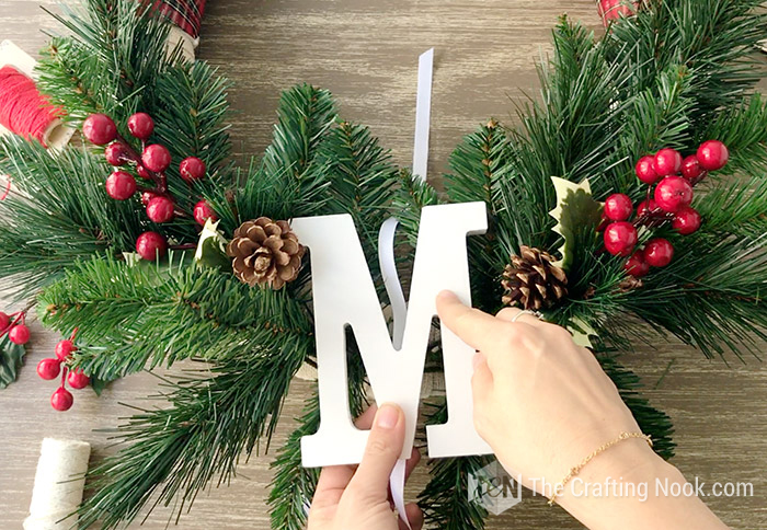  placing the letter on top of the Spring stems