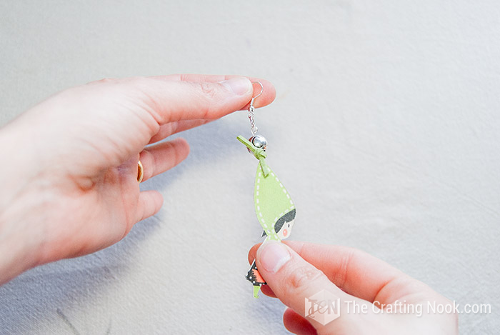 showing how the knot looks on the wooden earring
