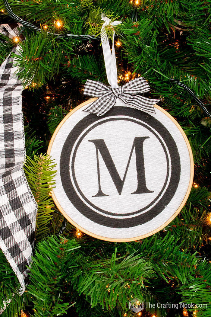 Closeup of the Stenciled DIY Monogrammed embroidery hoop ornaments on the tree