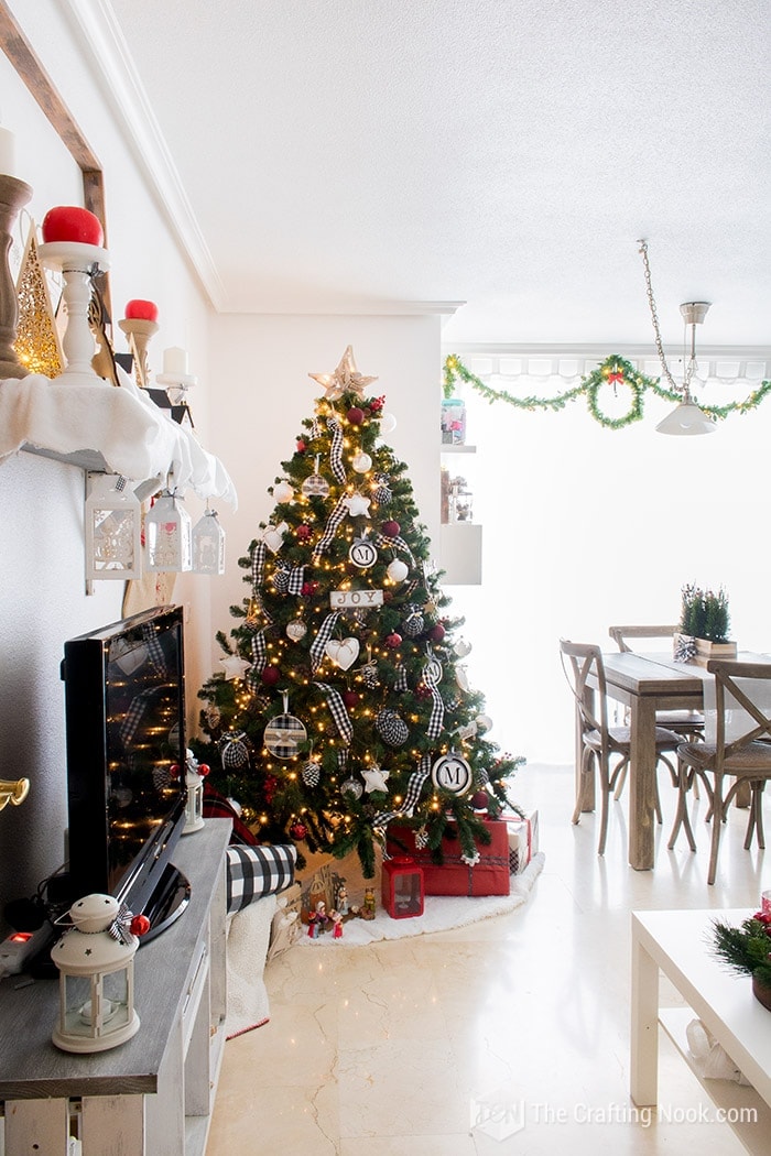 general view of christmas tree in living room 