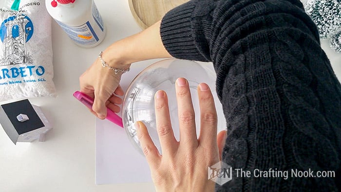 drawing a circle on the cardboard with the help of a glass bowl